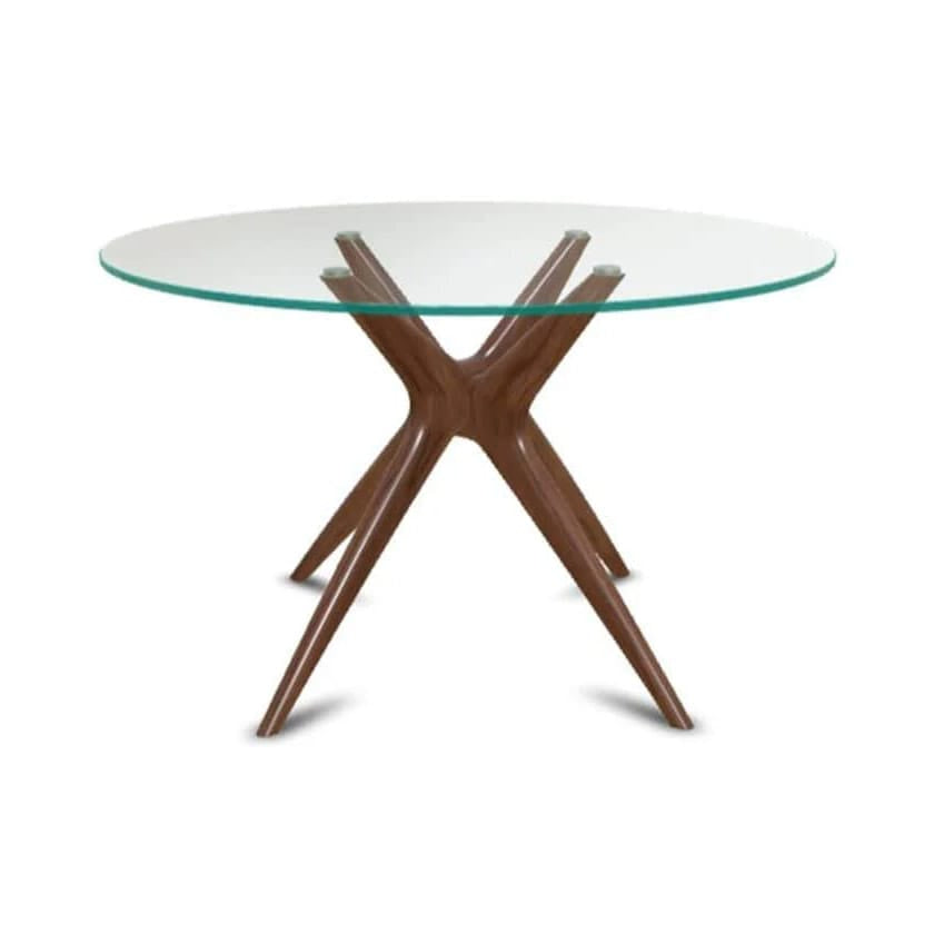 Glass-top dining table with wooden star-shaped base on a white background